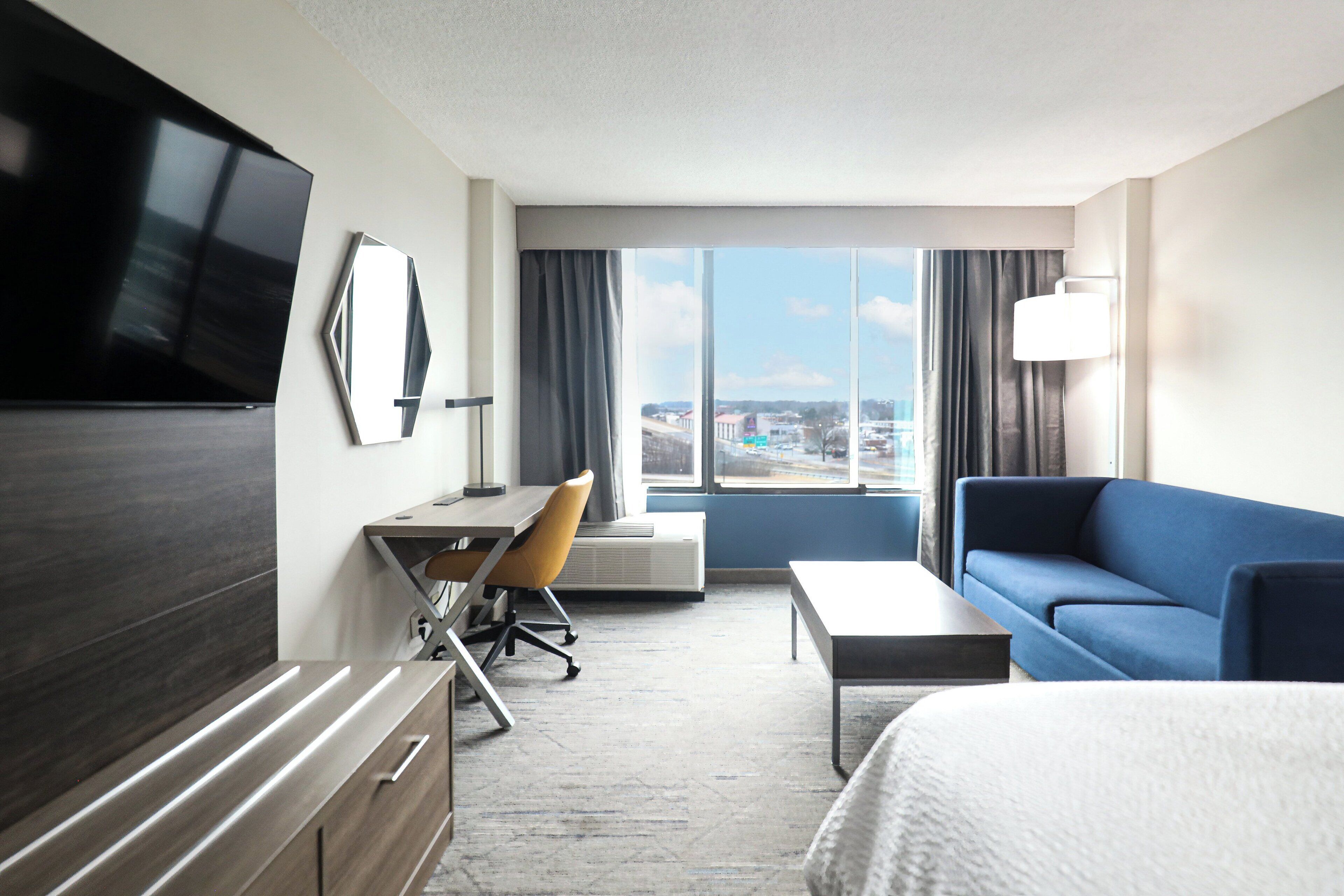 Desk, laptop workspace, blackout curtains, iron/ironing board