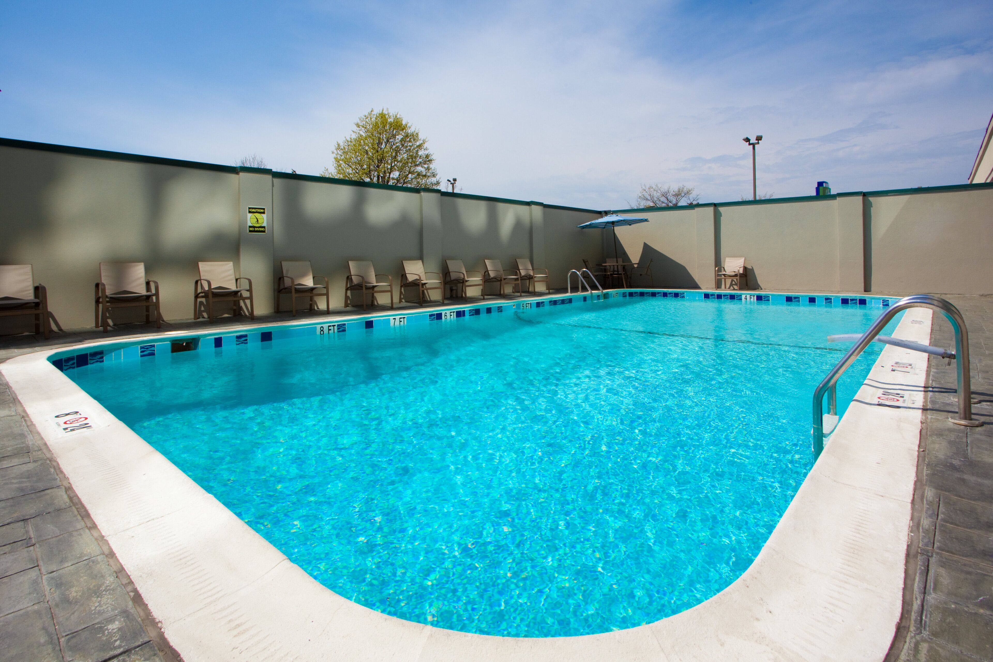 outdoor pool, open 2:00 pm to 9:00 pm, pool loungers