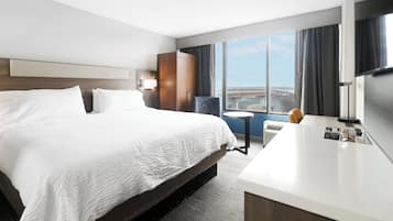 Desk, laptop workspace, blackout drapes, iron/ironing board