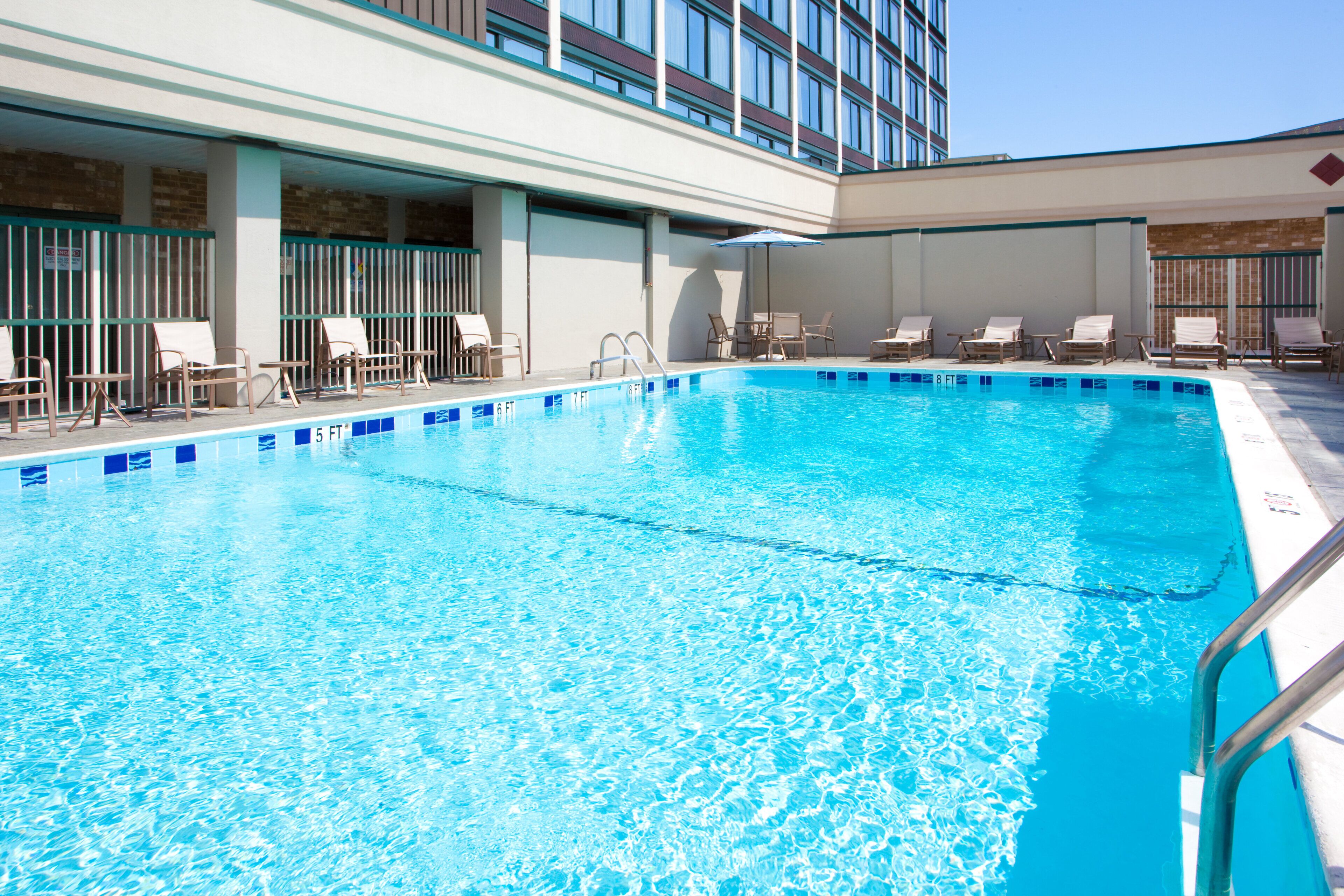 outdoor pool, open 2:00 pm to 9:00 pm, pool loungers