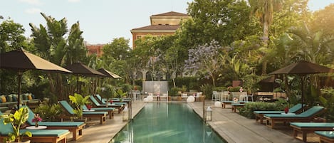 Seasonal outdoor pool, open 10:00 AM to 7:00 PM, pool loungers