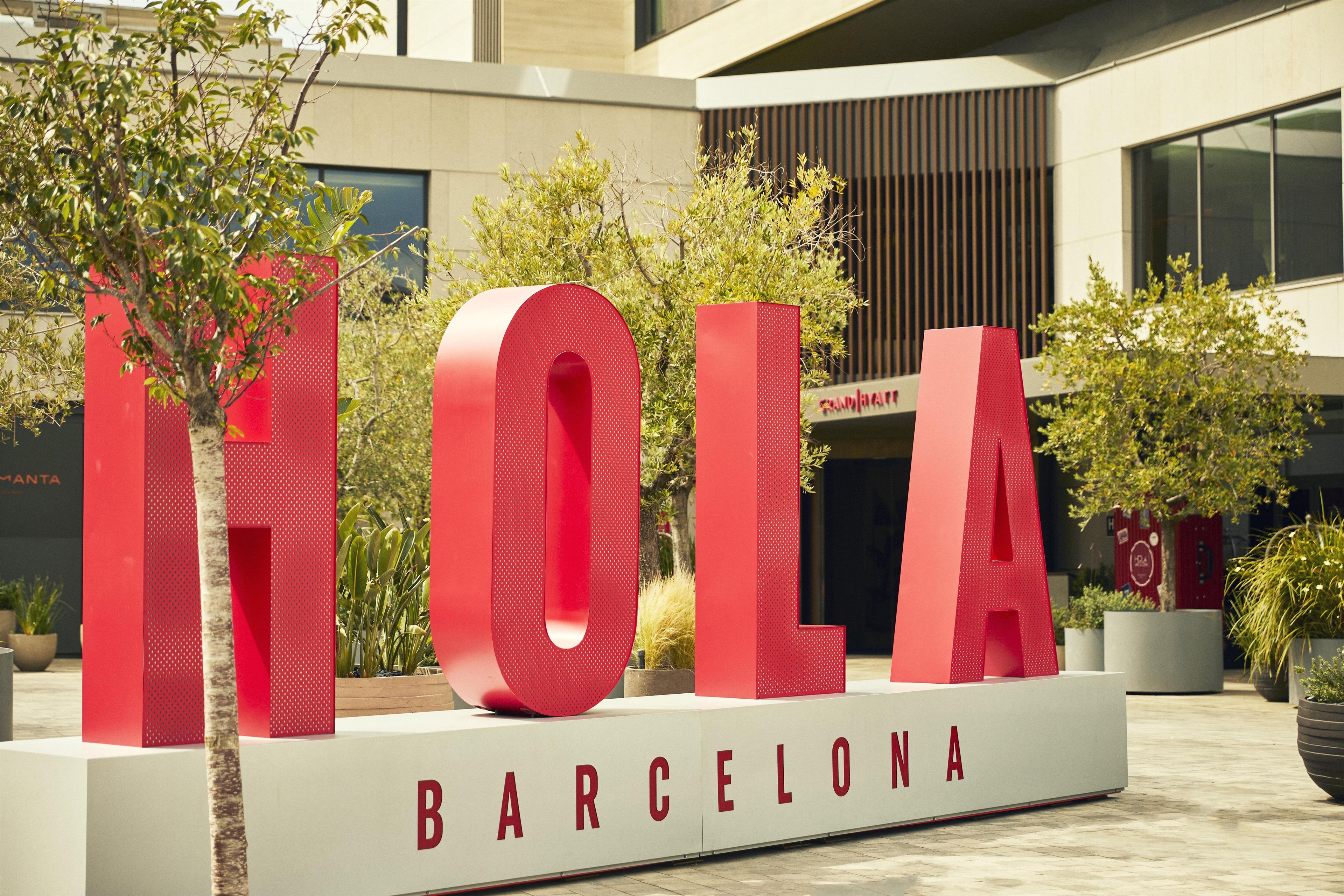 A large outdoor sign with the letters 'HOTEL' and 'BARCELONA' indicating a hotel location.