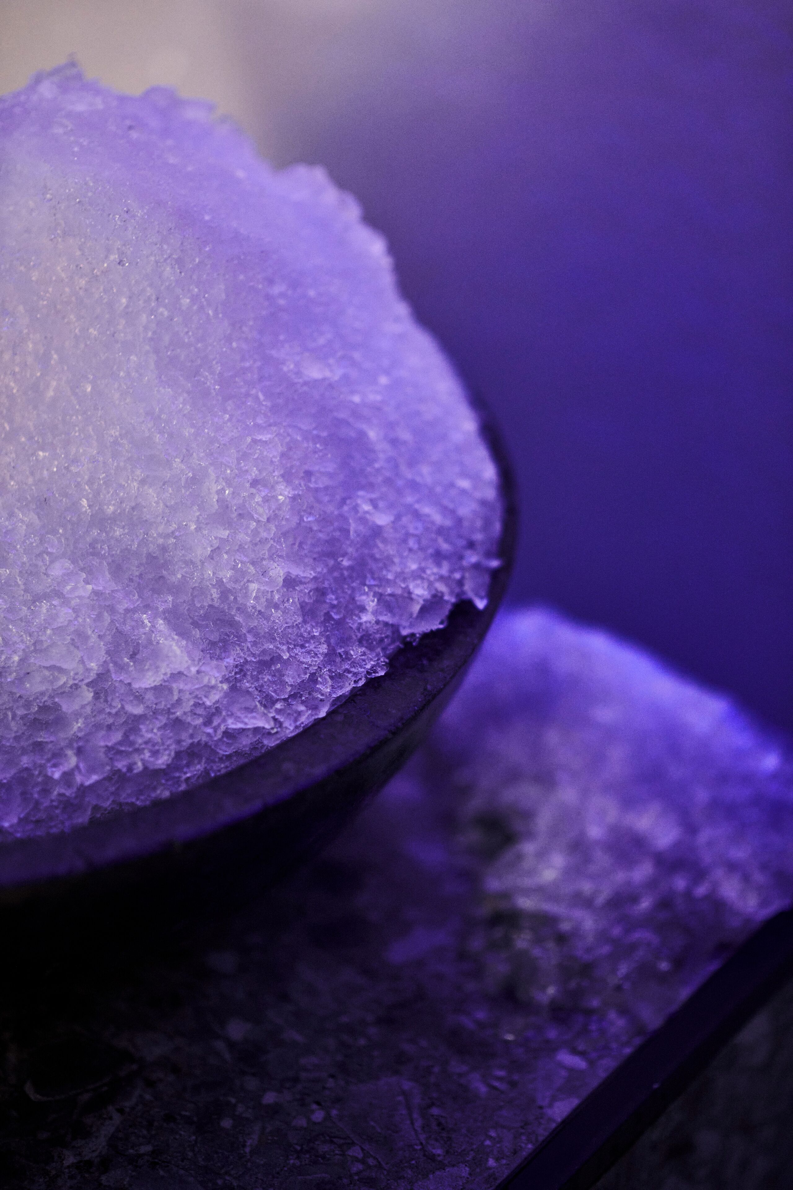 A close-up of a bowl filled with ice cubes.