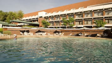Outdoor pool, pool umbrellas, sun loungers