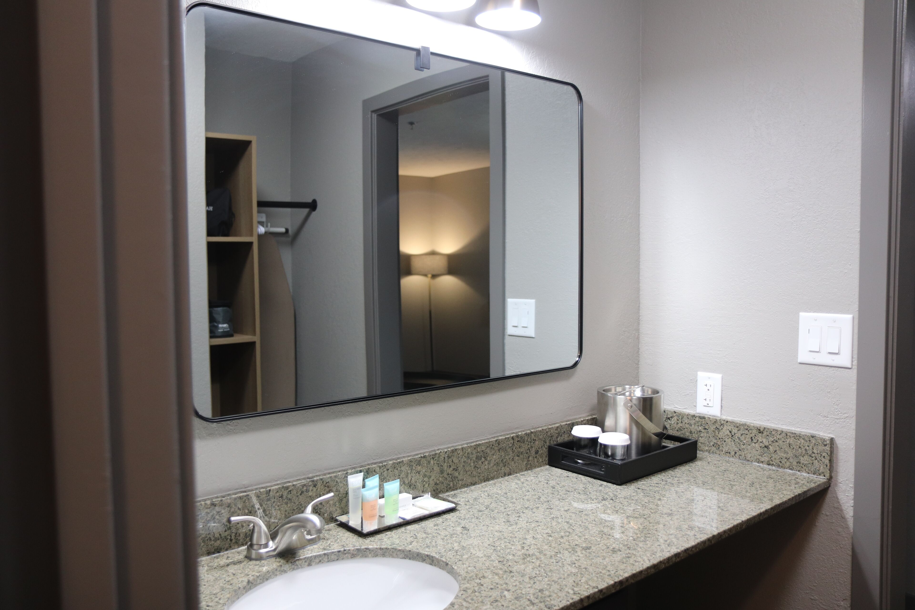 designer toiletries, hair dryer, towels