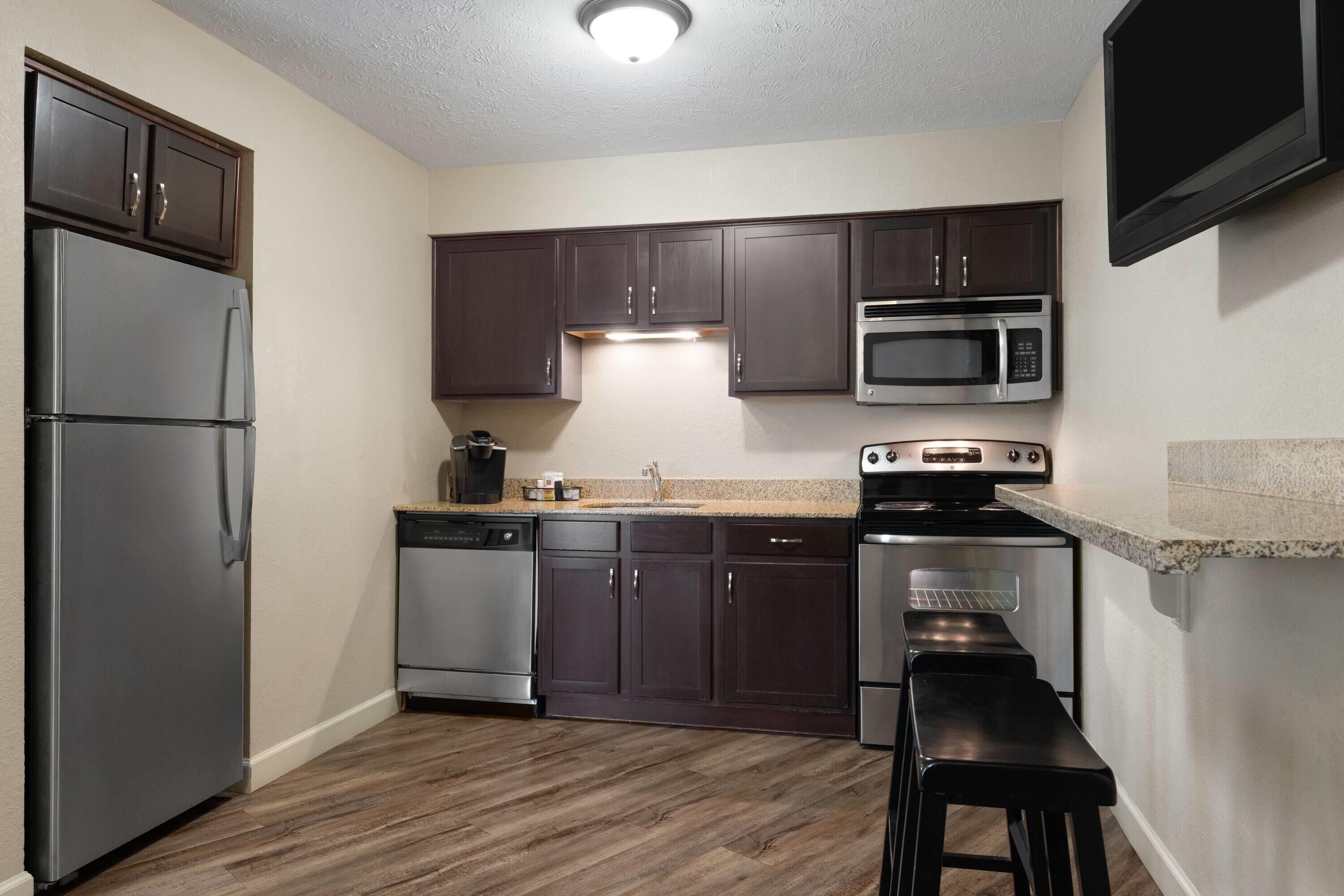 luxury suite, 1 bedroom, non smoking | premium bedding, desk, laptop workspace, iron/ironing board