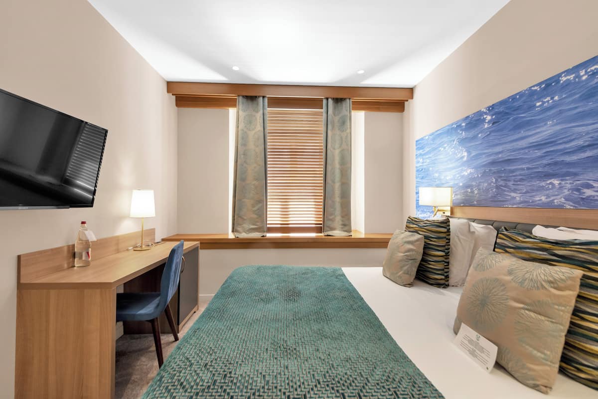 Ropa de cama de alta calidad y minibar