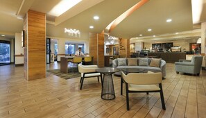 Relax in our welcoming lobby, featuring a reception area, comfortable seating, and a bar for refreshments.