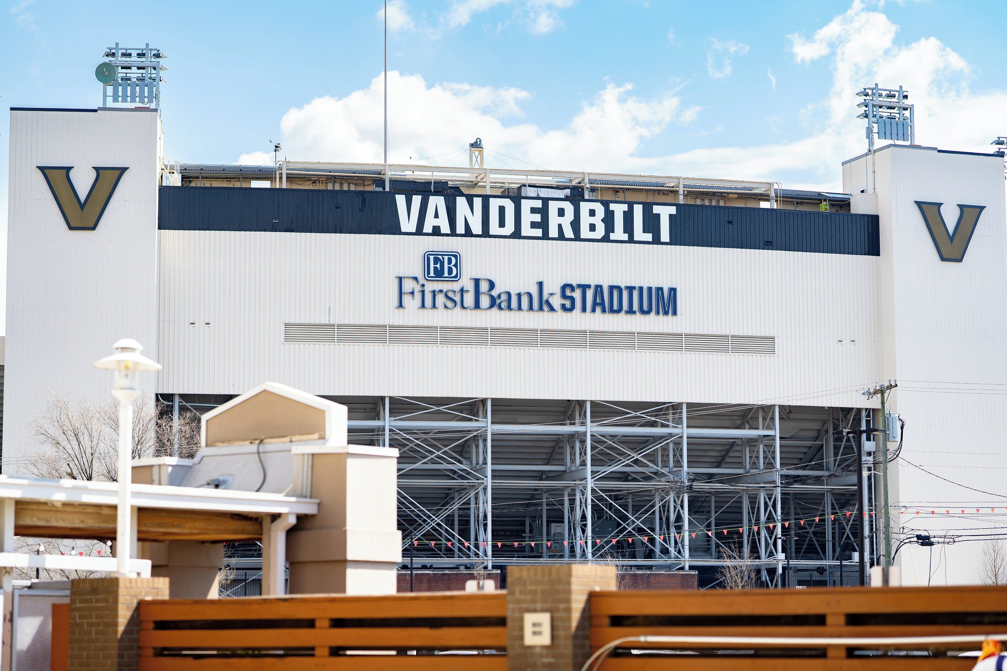 The exterior of Vanderbilt FirstBank Stadium with its distinctive 'V' logo and name.
