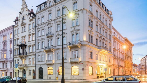 A historic building with ornate architecture, large windows, and a prominent entrance. - Best Western Hotel Moran (Prague)
