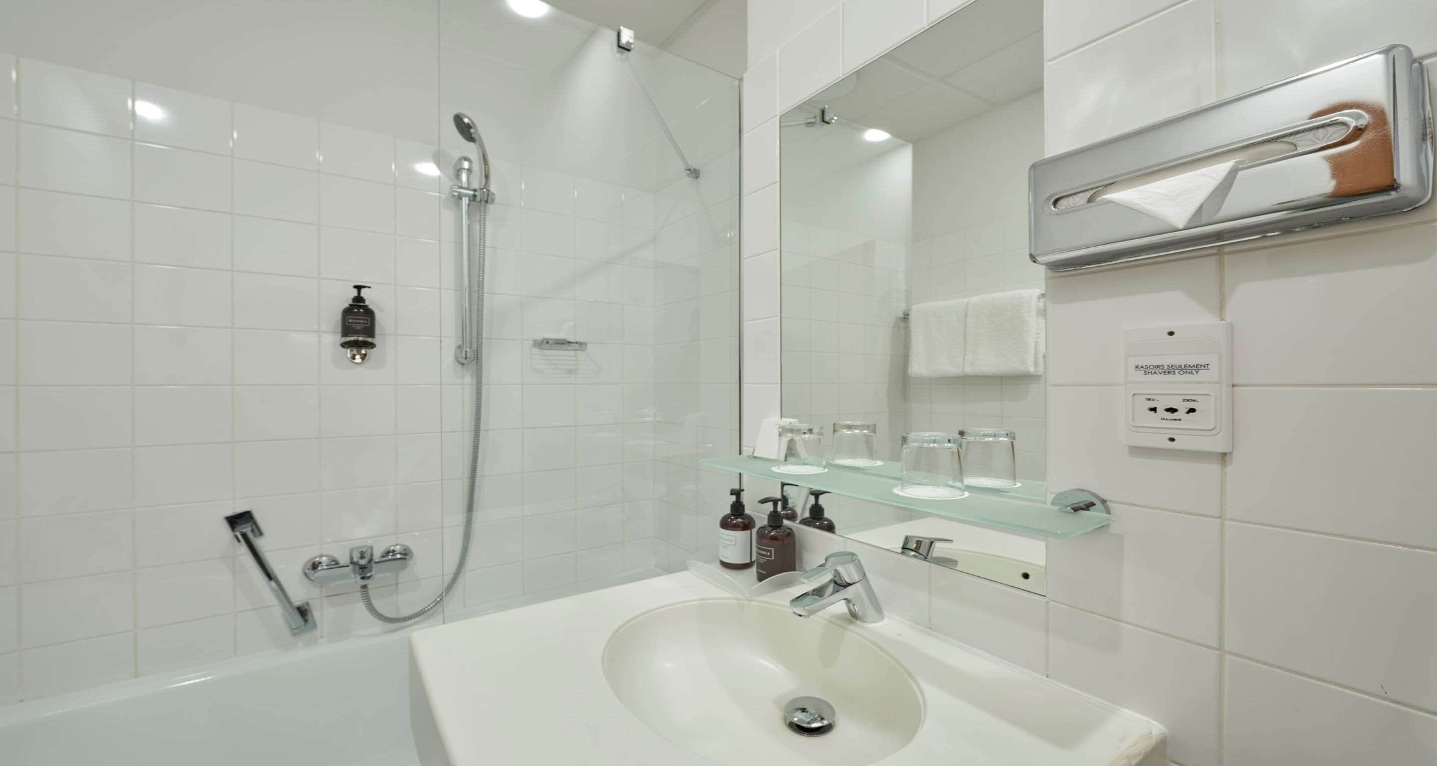 bathtub, hair dryer, towels