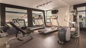 A gym with treadmills, elliptical machines, and weight equipment. - Hampton Inn Des Moines-Airport (Des Moines)