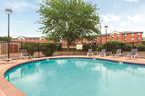 Seasonal outdoor pool, pool loungers