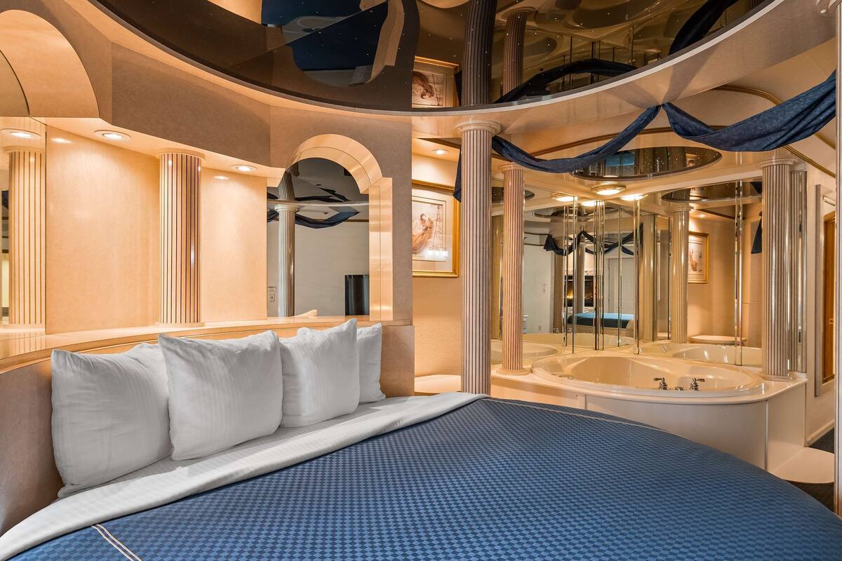 suite, 1 king bed, non smoking, jetted tub | blackout curtains, iron/ironing board, rollaway beds, free wifi