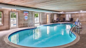 An indoor swimming pool with clear water, wooden walls, and a lifeguard station. - Best Western Galena Inn & Suites (Galena)