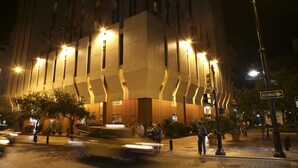 A modern building with a unique architectural design, featuring a central courtyard with trees and a fountain. - Hotel Continental (Guayaquil)