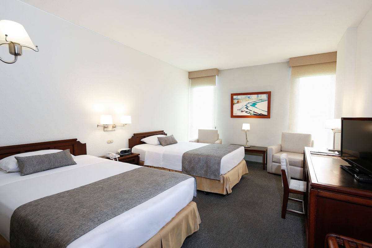 Premium bedding, down duvets, in-room safe, desk
