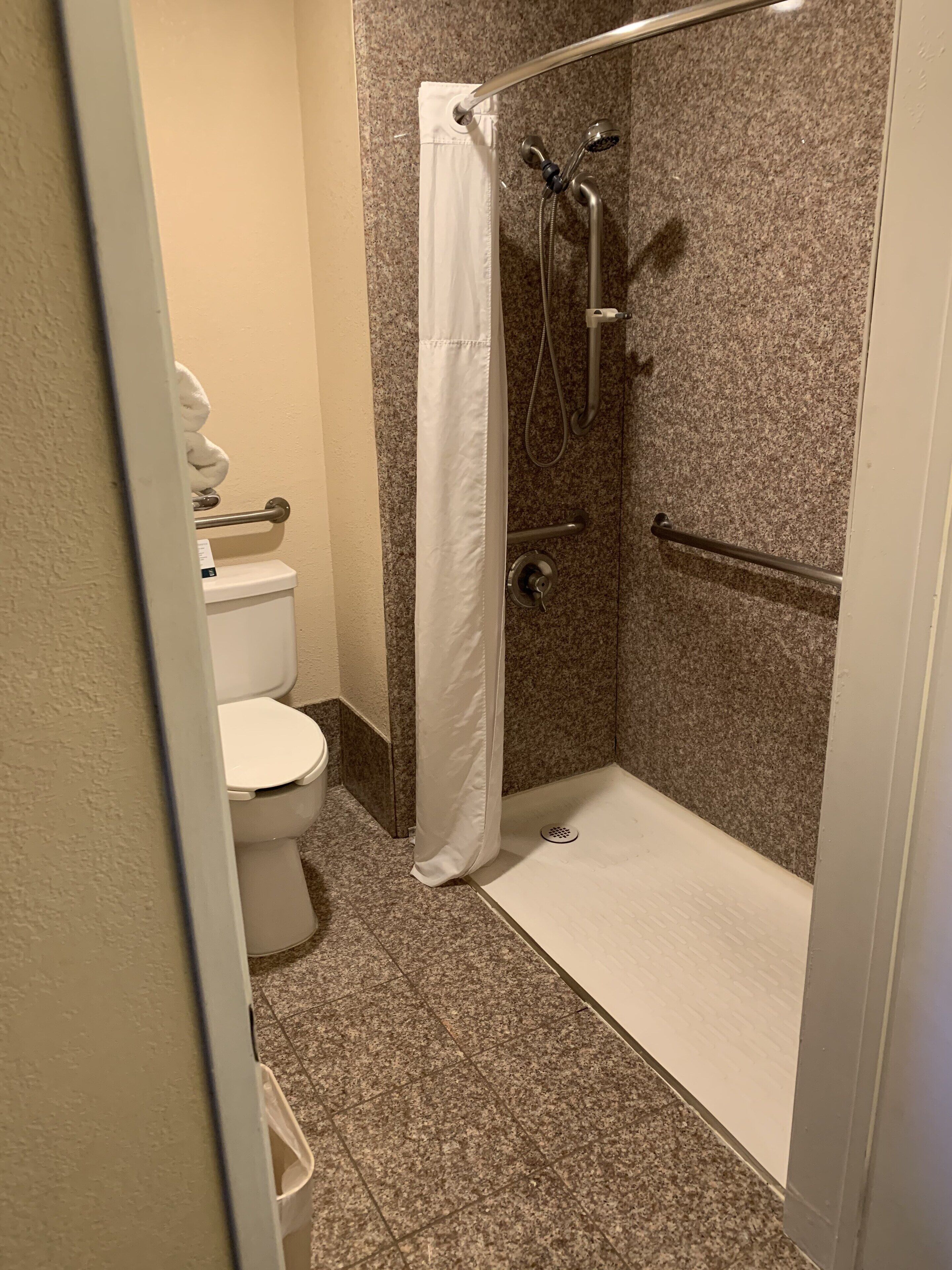 combined shower/bathtub, free toiletries, hair dryer, towels
