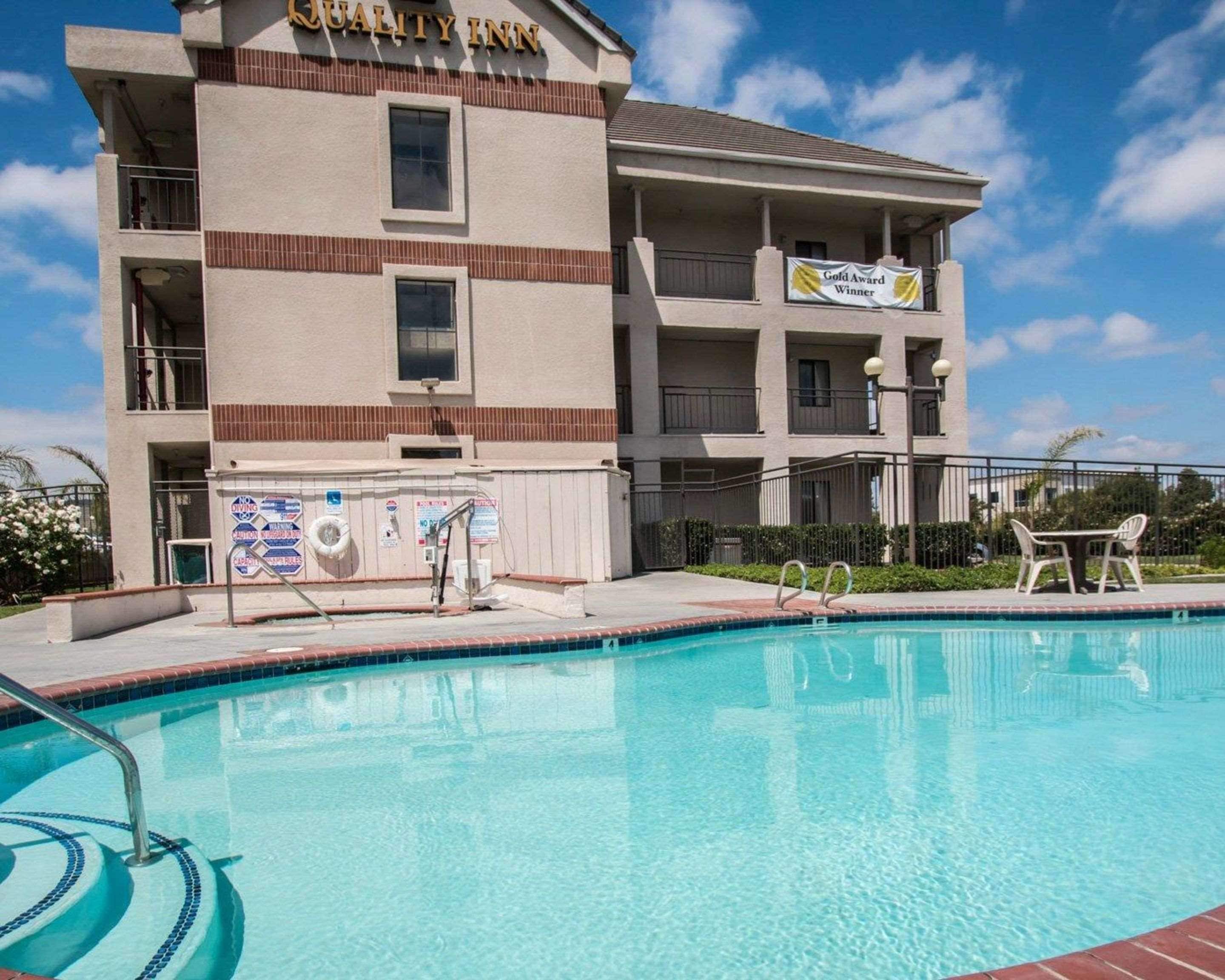 Outdoor pool, open 8:00 AM to 10:00 PM, pool umbrellas, sun loungers