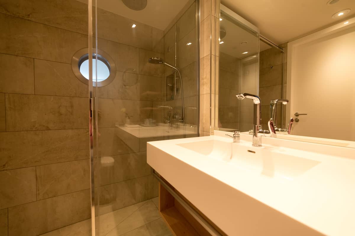 eco-friendly toiletries, hair dryer, bathrobes, slippers