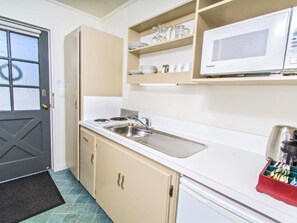 Mini-fridge, microwave, stovetop, coffee/tea maker