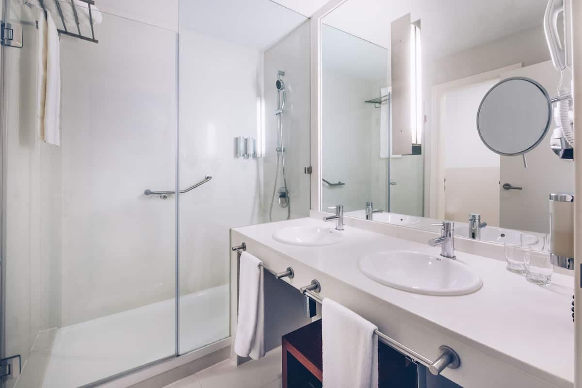 eco-friendly toiletries, hair dryer, bathrobes, slippers