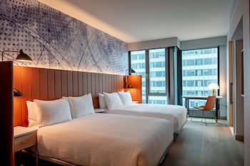 Premium bedding, down comforters, in-room safe, desk at Tempo by Hilton New York Times Square