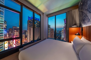Premium bedding, down comforters, in-room safe, desk at Tempo by Hilton New York Times Square