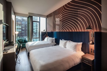 Premium bedding, down comforters, in-room safe, desk at Tempo by Hilton New York Times Square