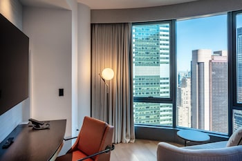 Premium bedding, down comforters, in-room safe, desk at Tempo by Hilton New York Times Square