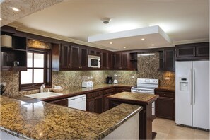 Full-sized fridge, microwave, cookware/dishes/utensils
