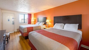 A hotel room with two beds, a desk, and a window with curtains. - Budget Inn Norfolk Va (Norfolk)