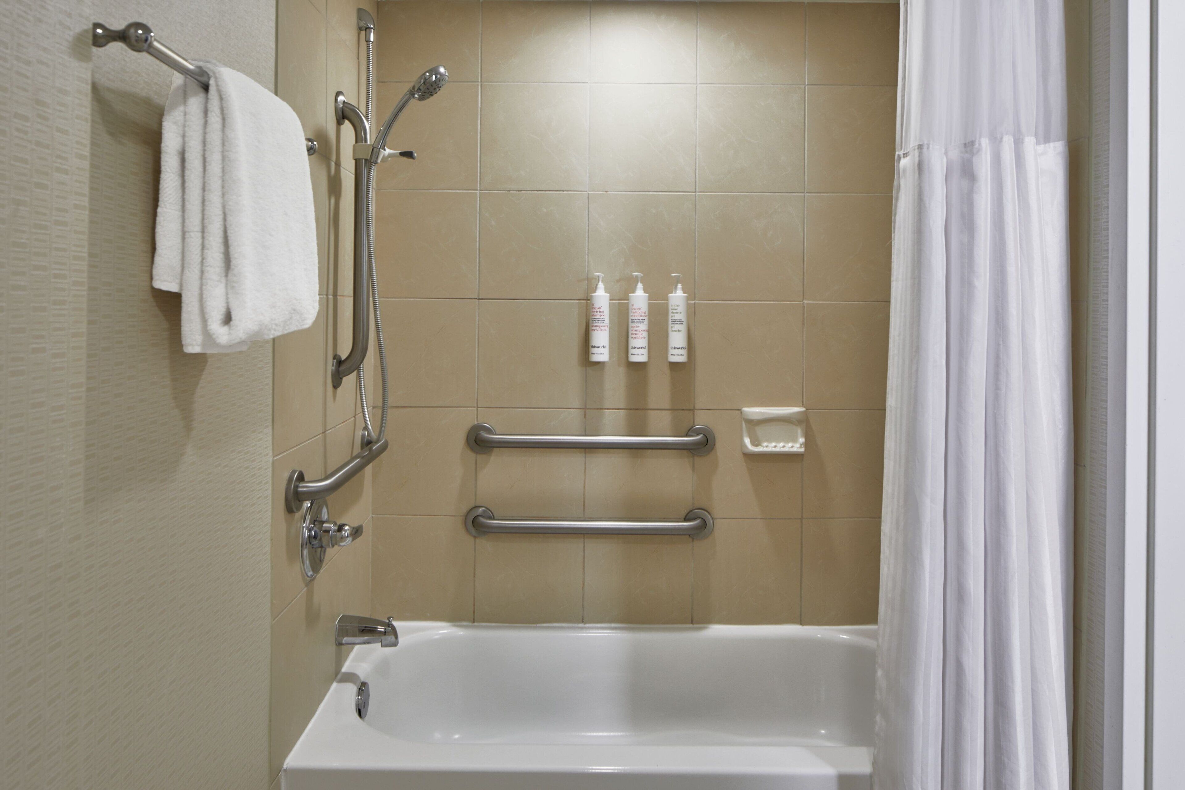 deep-soaking bathtub, rainfall showerhead, free toiletries, hair dryer