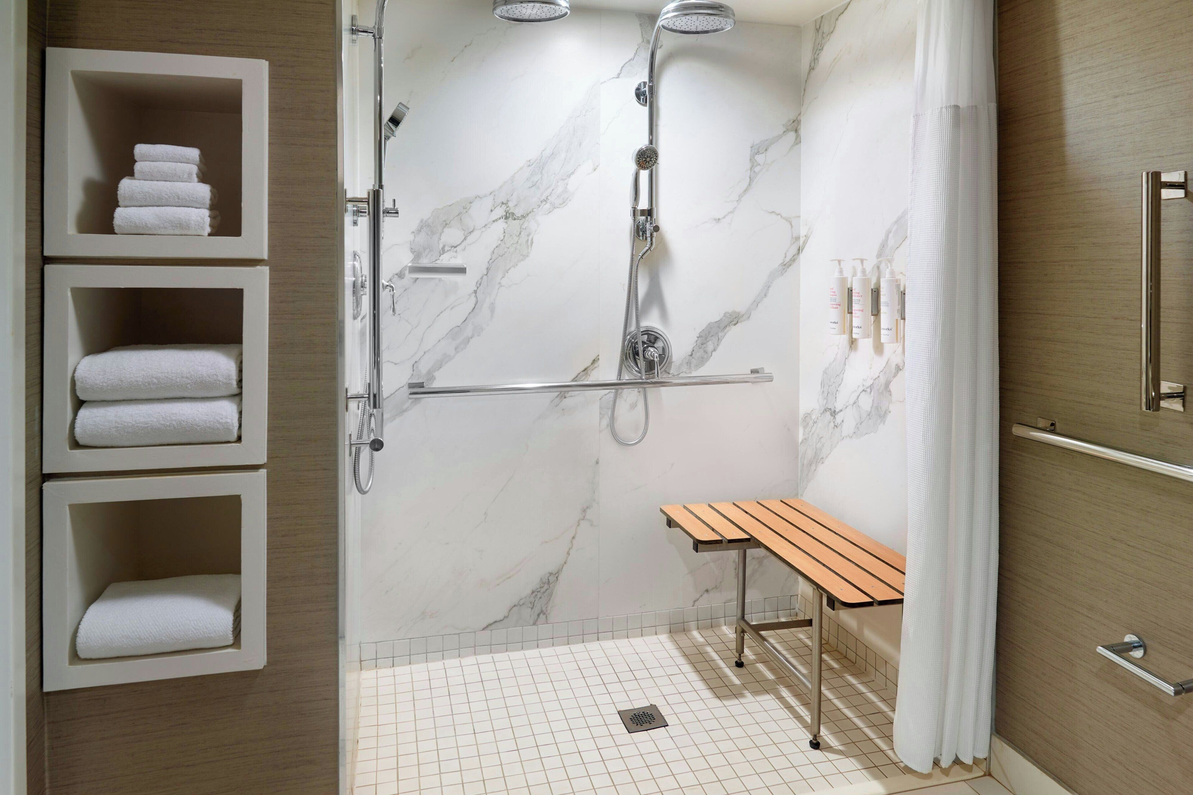 designer toiletries, hair dryer, towels