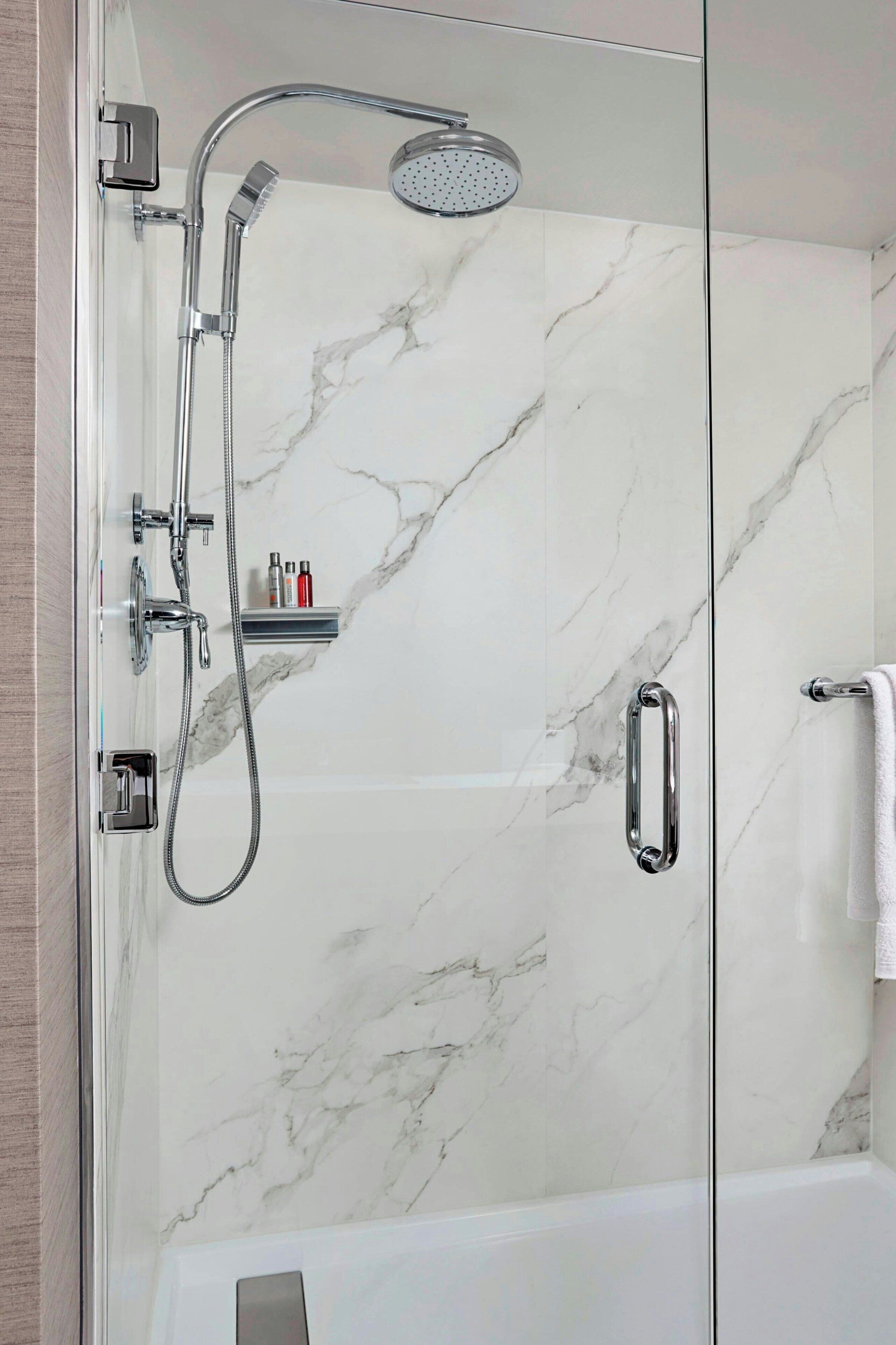 designer toiletries, hair dryer, towels