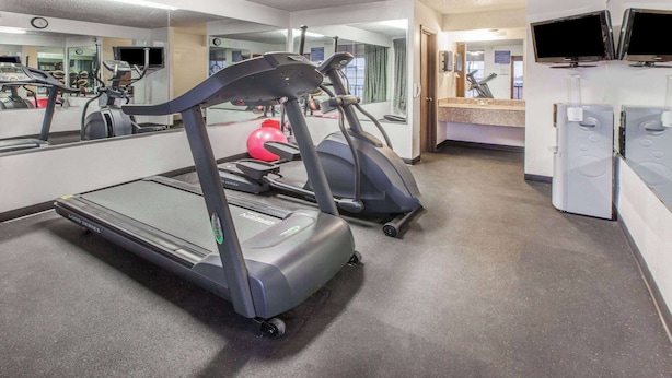 A gym with treadmills, a stationary bike, and a red exercise ball. - Days Inn by Wyndham El Reno (El Reno)