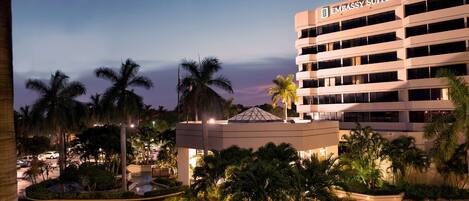 A multi-story building with a sign reading "Embassy Suites."