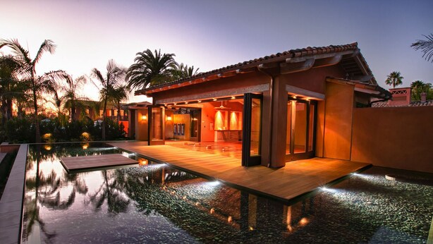 A modern resort with a swimming pool, a covered outdoor area, and a sunset view. - Rancho Valencia Resort and Spa (Rancho Santa Fe)