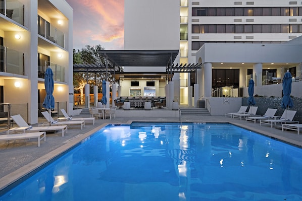 Outdoor pool, open 10:00 AM to 11:00 PM, pool umbrellas, pool loungers