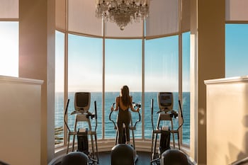 An outdoor wedding ceremony setup with a clear view of the ocean and hills in the background. at The Ritz-Carlton, Laguna Niguel