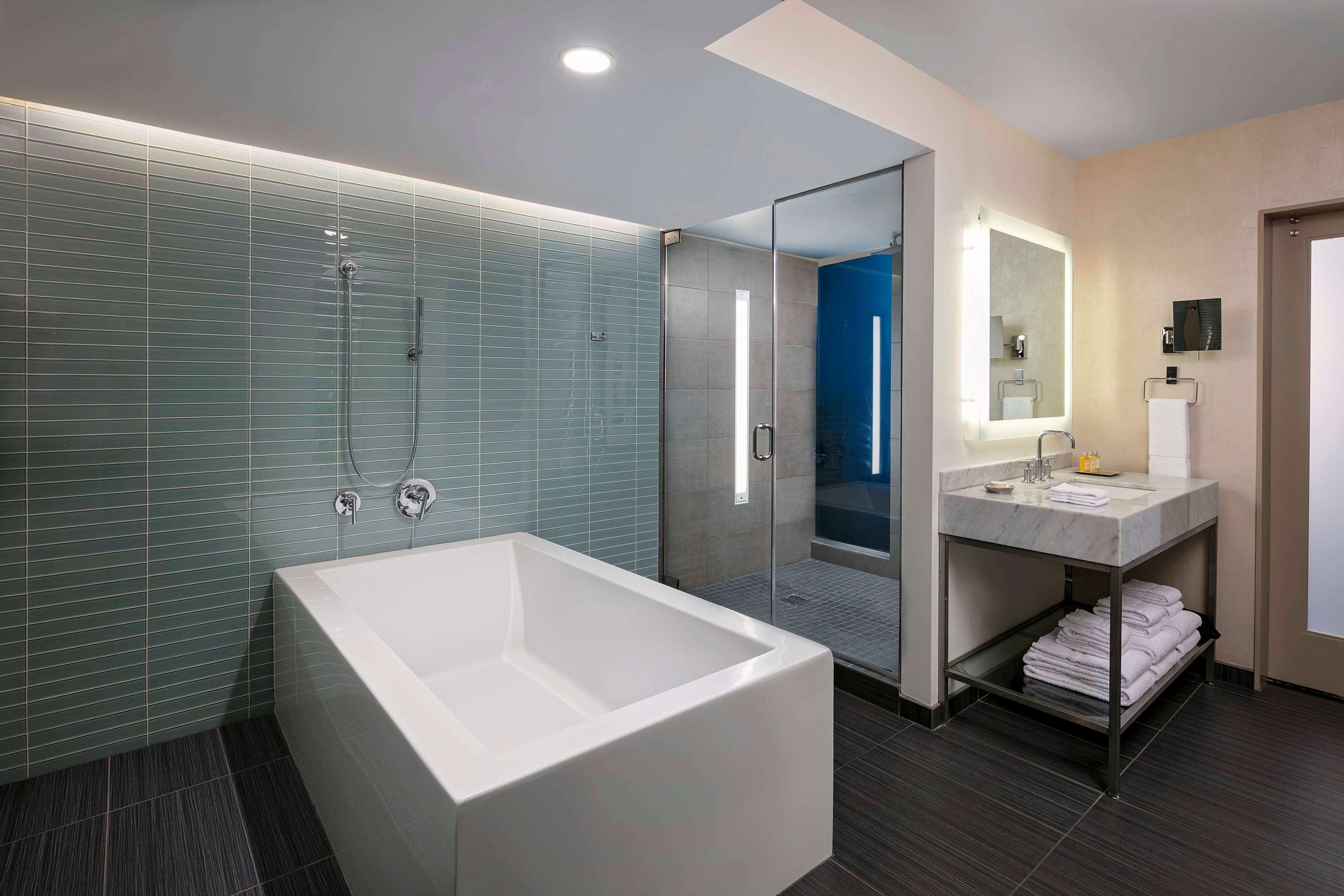 combined shower/bathtub, eco-friendly toiletries, hair dryer, bathrobes