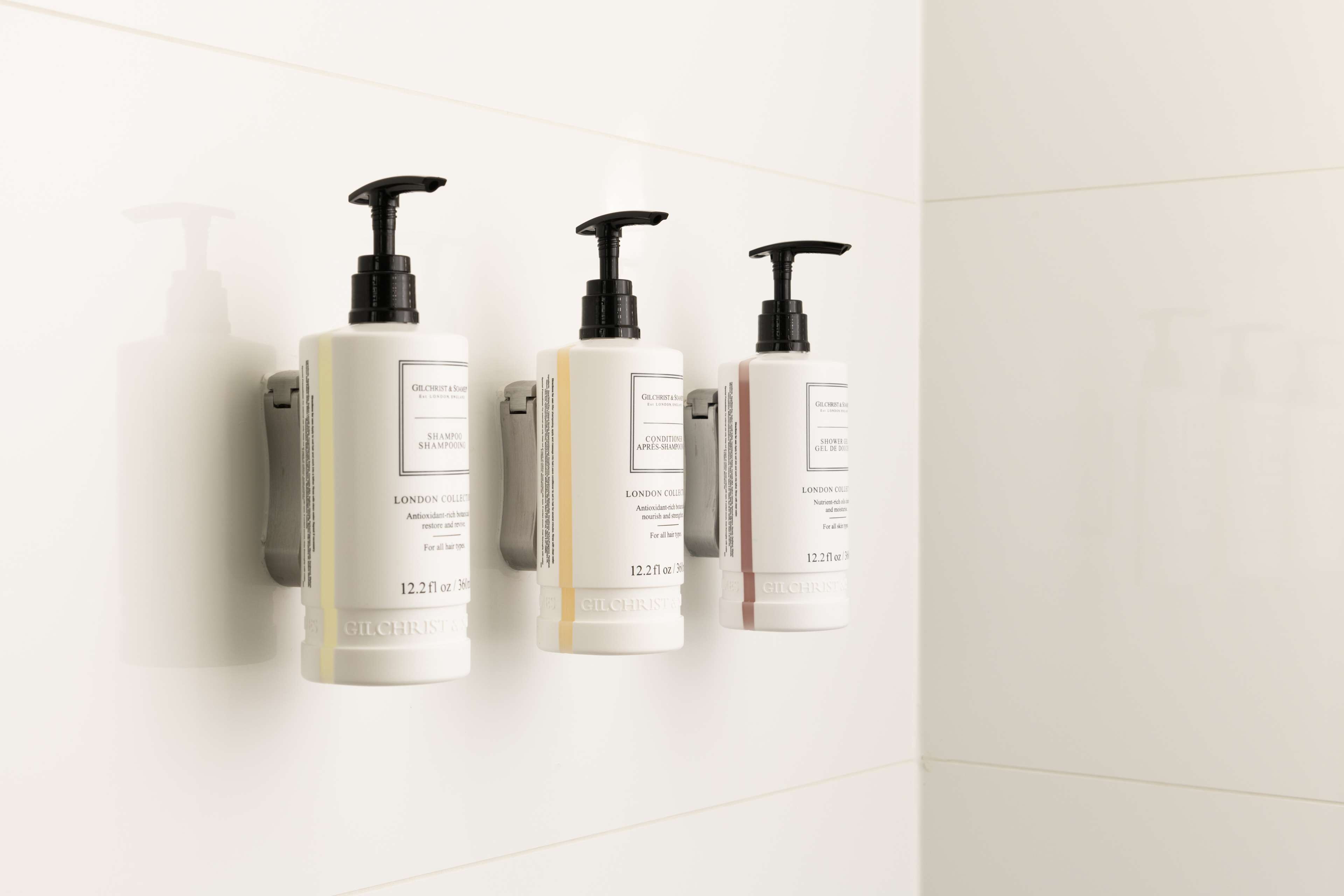 designer toiletries, hair dryer, towels