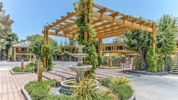 Outdoor pool, open 10:00 AM to 9:00 PM, pool umbrellas, pool loungers