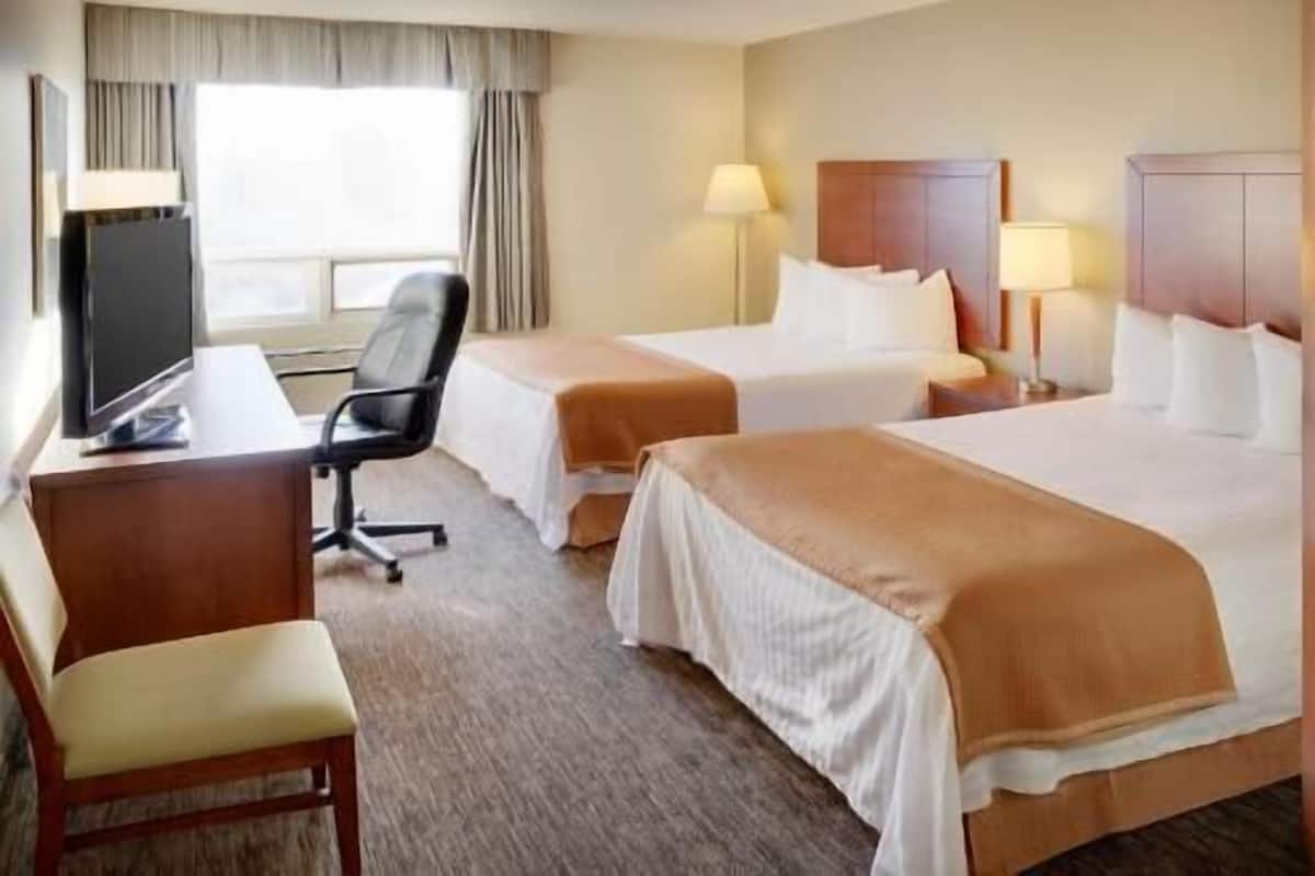 Pillowtop beds, desk, blackout drapes, iron/ironing board