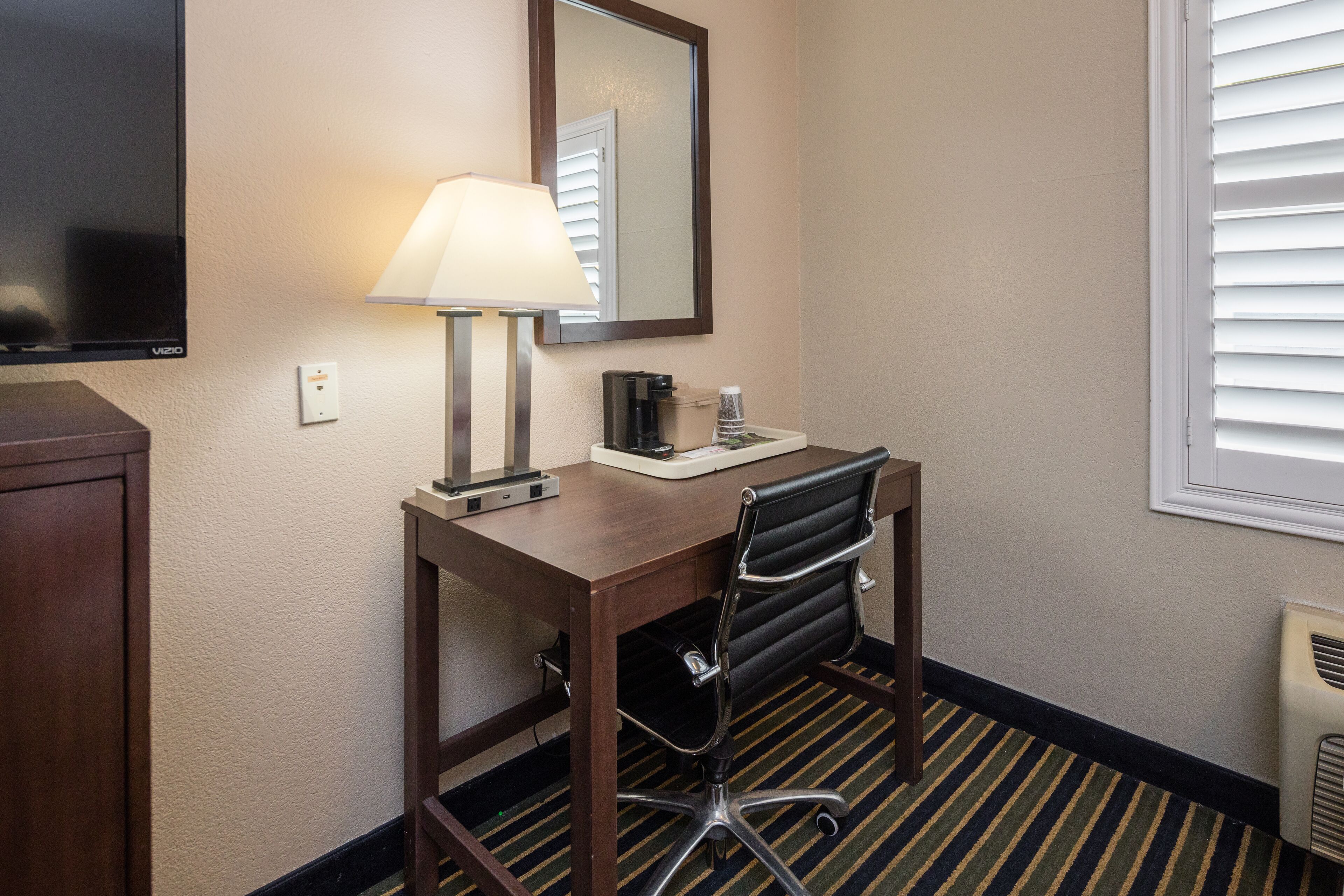 Room, 2 Queen Beds | Living area | 39-inch flat-screen TV with satellite channels, TV