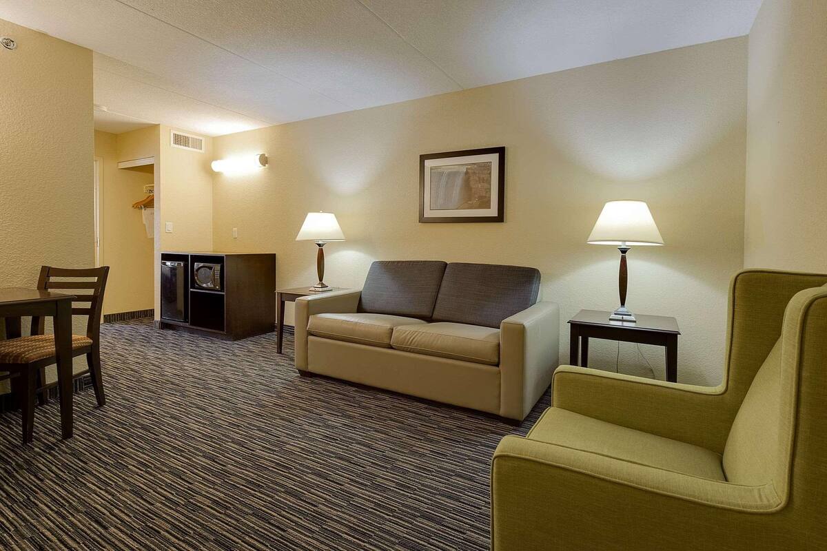 Premium bedding, desk, laptop workspace, blackout drapes