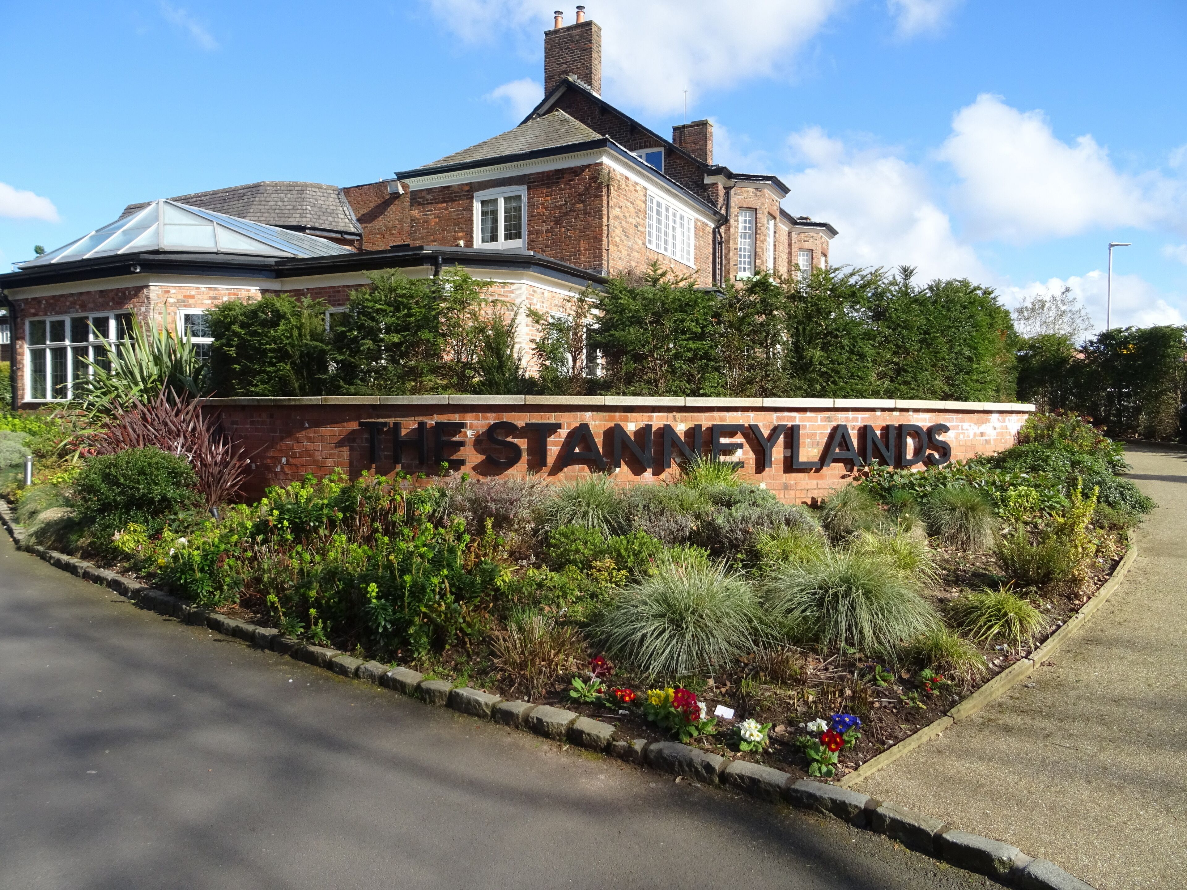 A brick building with a sign that reads "THE STANNEYLANDS".