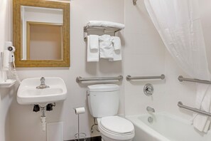 Room, 1 King Bed, Hearing Accessible | Bathroom | Combined shower/tub, free toiletries, hair dryer, towels
