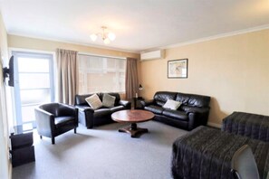 Standard Suite, 2 Bedrooms, Non Smoking, Shared Bathroom (Unit) | Living area | 32-inch flat-screen TV with digital channels, TV, Netflix