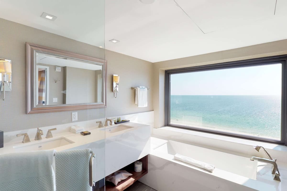 family suite | bathroom | hydromassage showerhead, designer toiletries, hair dryer, towels